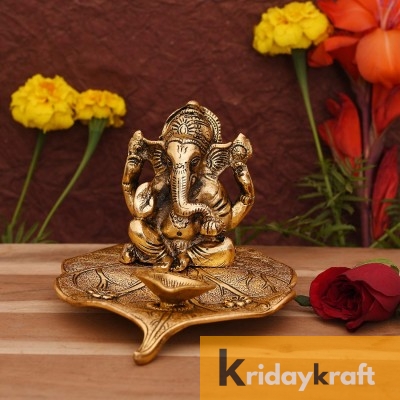 Ganesha sitting on leaf with oil lamp diya xl size gold plated for home decor and gifts