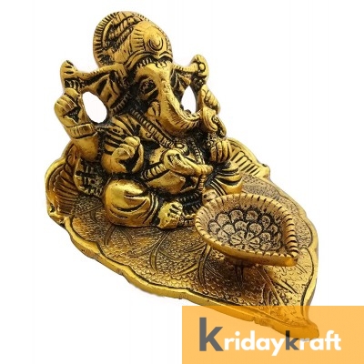 Ganesha sitting on leaf with diya gold plated for home decor