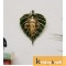 wall hanging ganesha face with green leaf gold plated metal 