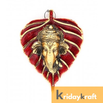 wall hanging ganesha face with red leaf gold plated metal 